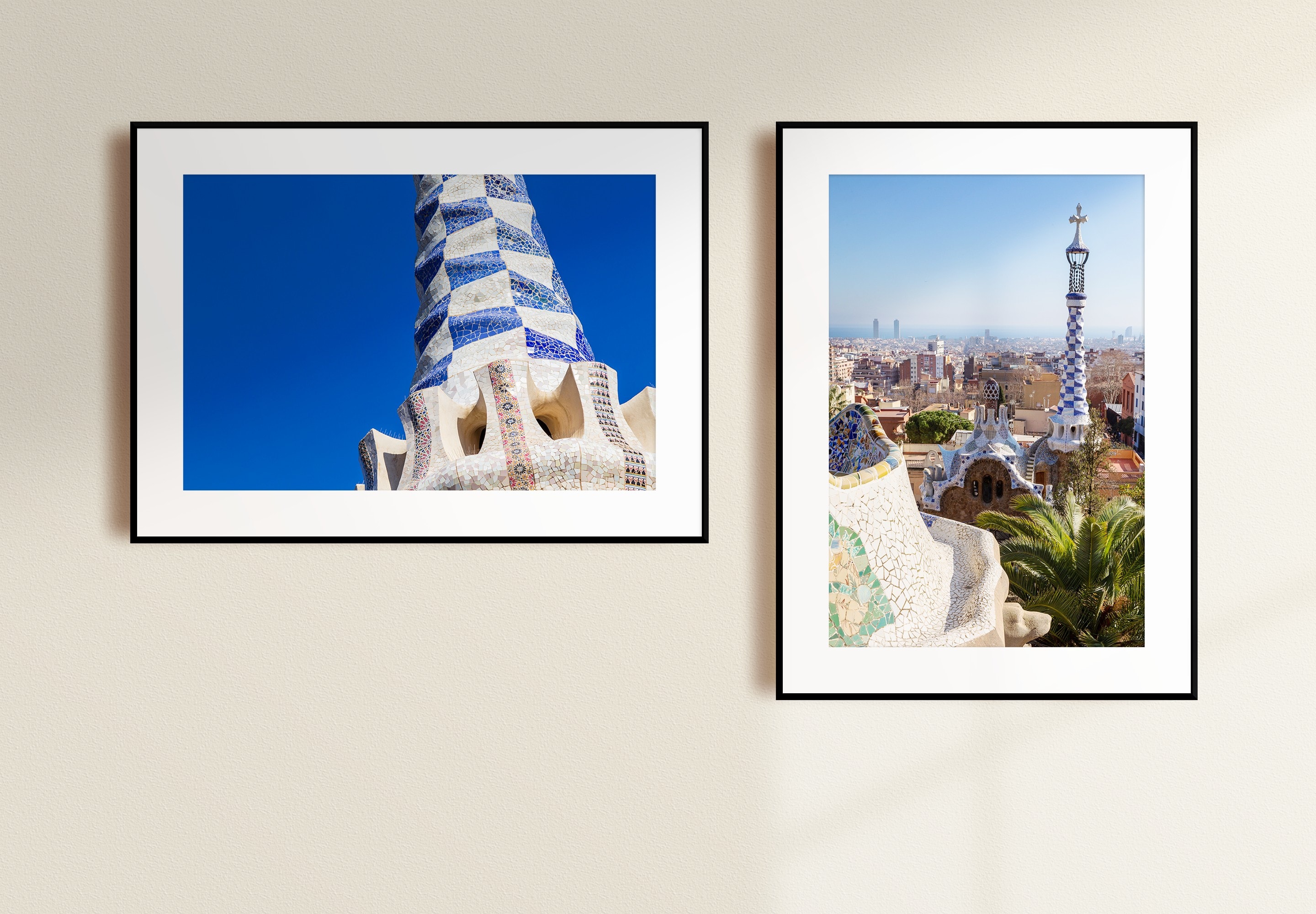 Two mounted fine art photographic prints. Landscape, to the left, showing Gaudí's Gingerbread House set agains a striking blue sky. Portrait, to the right, showing the spire from the Gingerbread House with the Barcelona cityscape behind — Barcelona, Spain