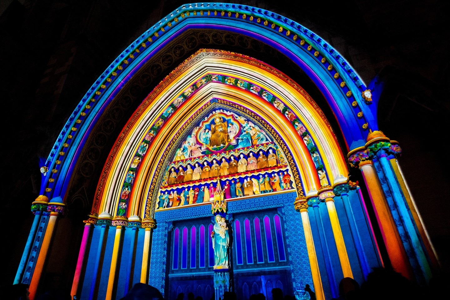 Westminster Abbey entrance illuminated by projected light during the night. Part of the Lumiere London 2018.