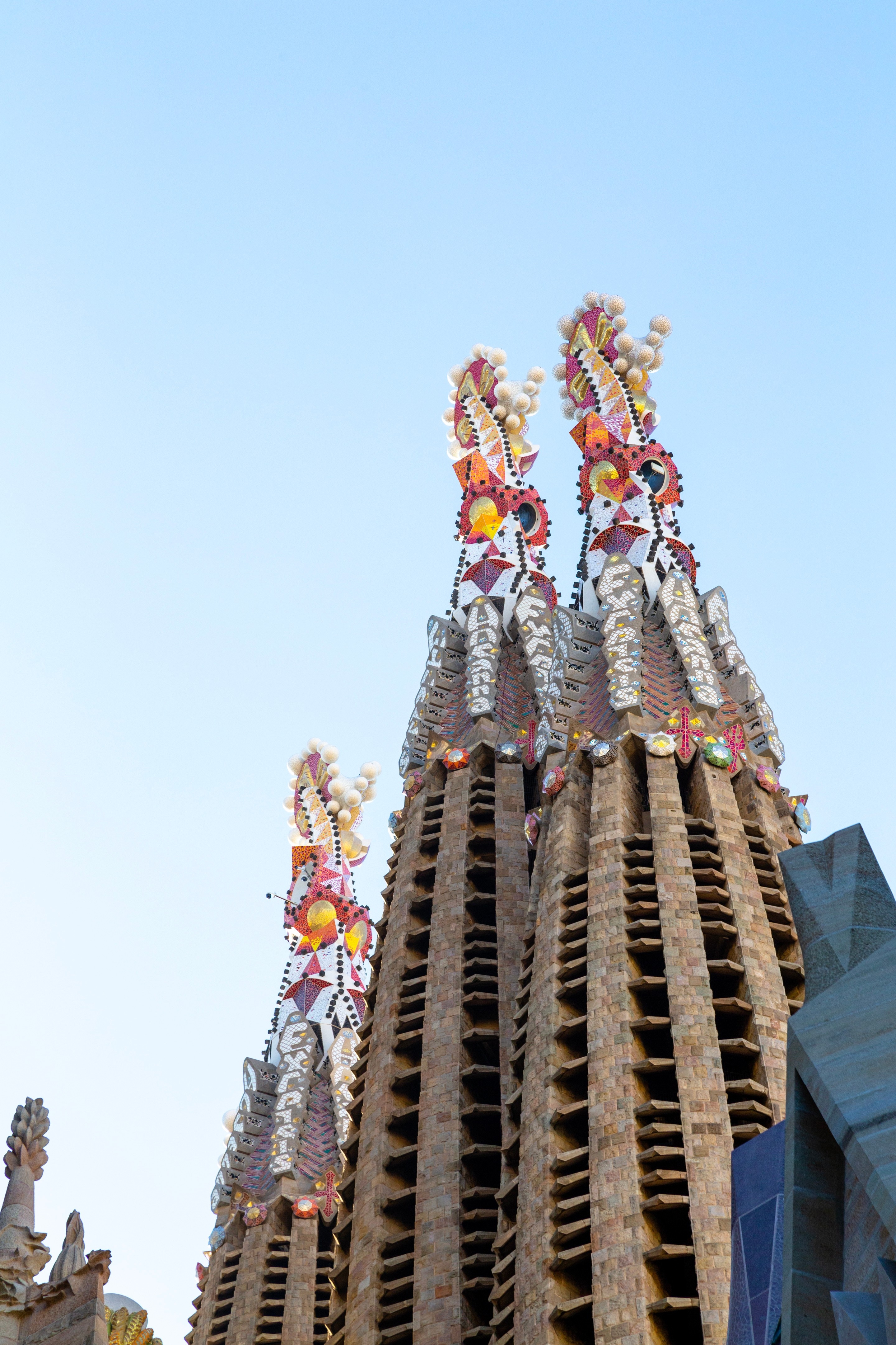 Showing three of the intricate tile covered spires on La Sagrada Familia