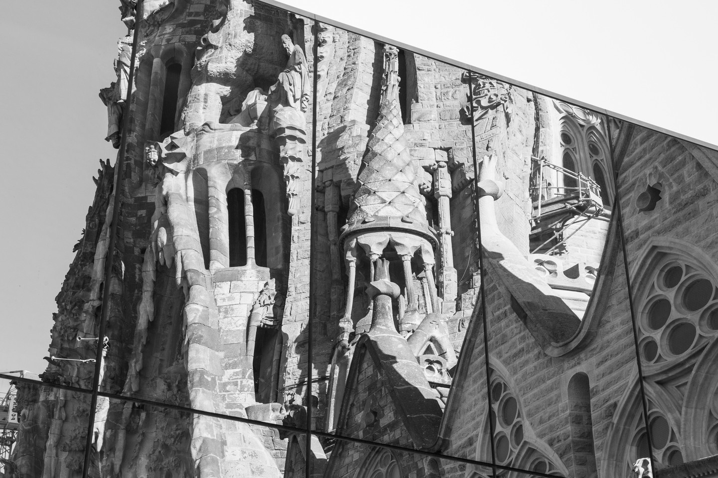 La Sagrada Familia reflected in an array of tall mirrors.