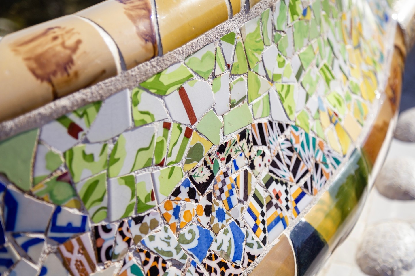 Intricate tiled seating area at Parc Guell, Barcelona.