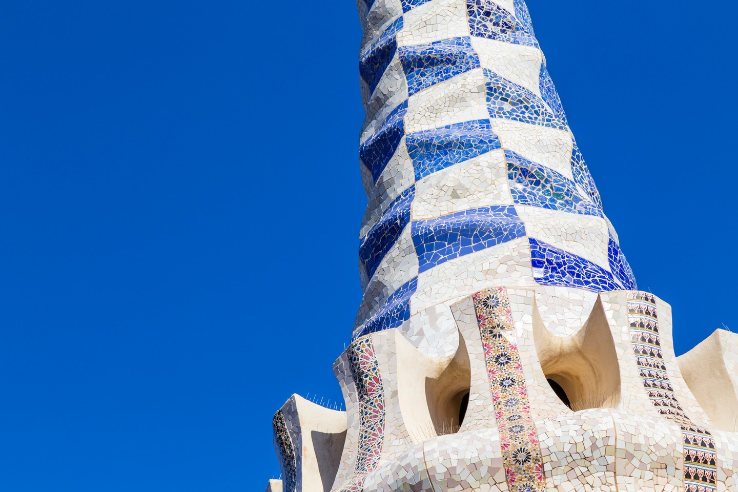 Intricate tiled tower at Parc Guell, Barcelona.