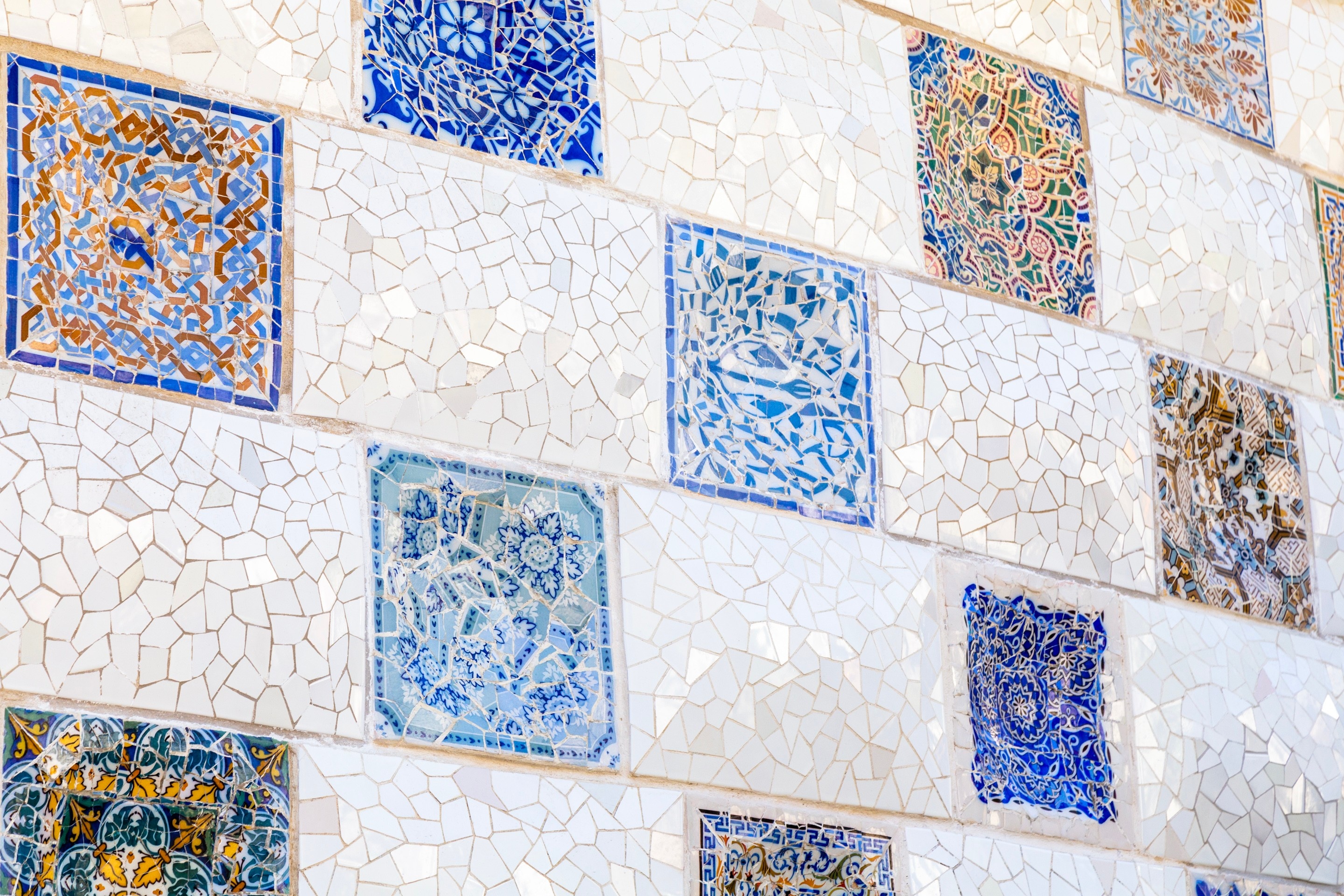 Tiled mosaic panels on a wall at Parc Guell, Barcelona.