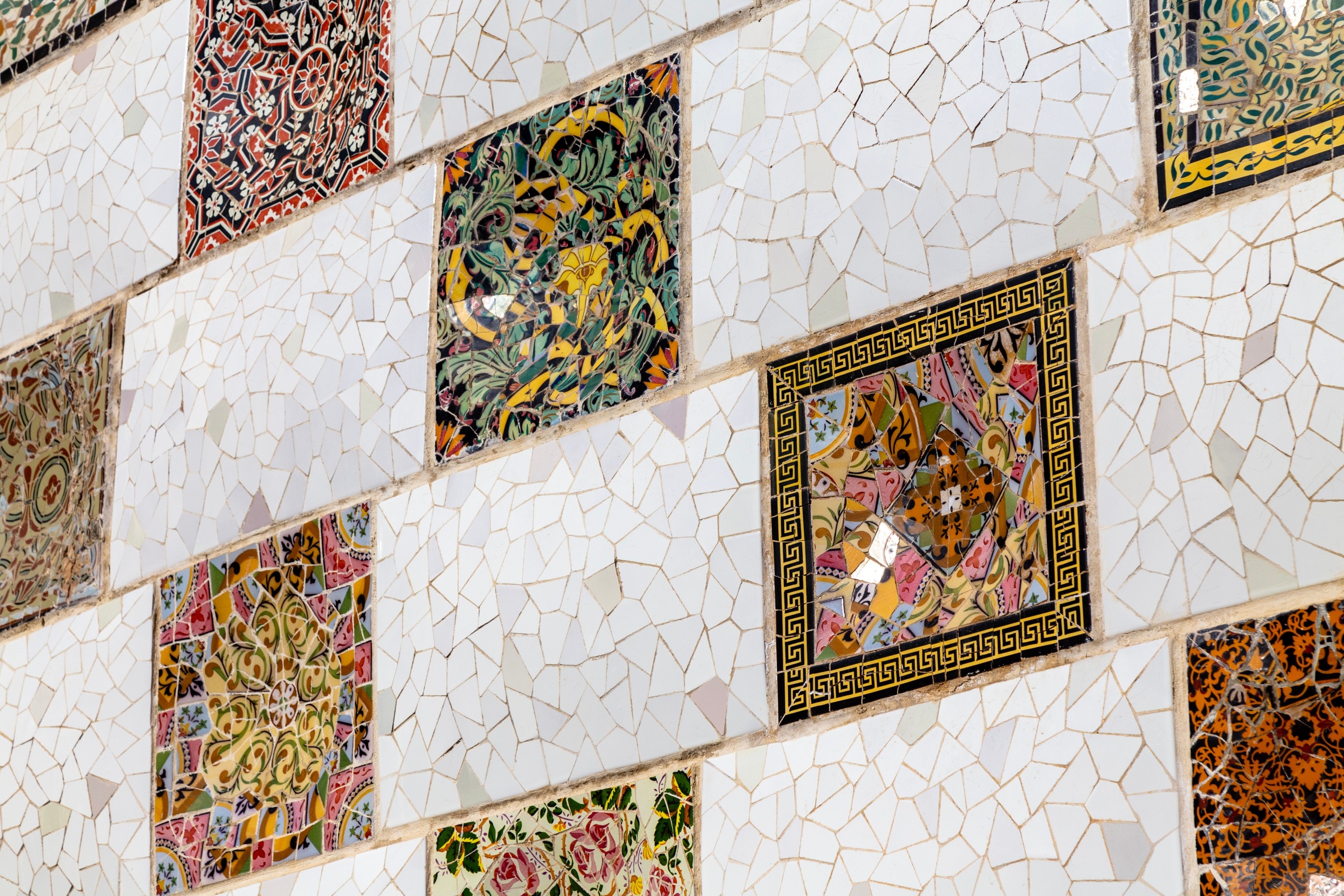 Tiled mosaic panels on a wall at Parc Guell, Barcelona.