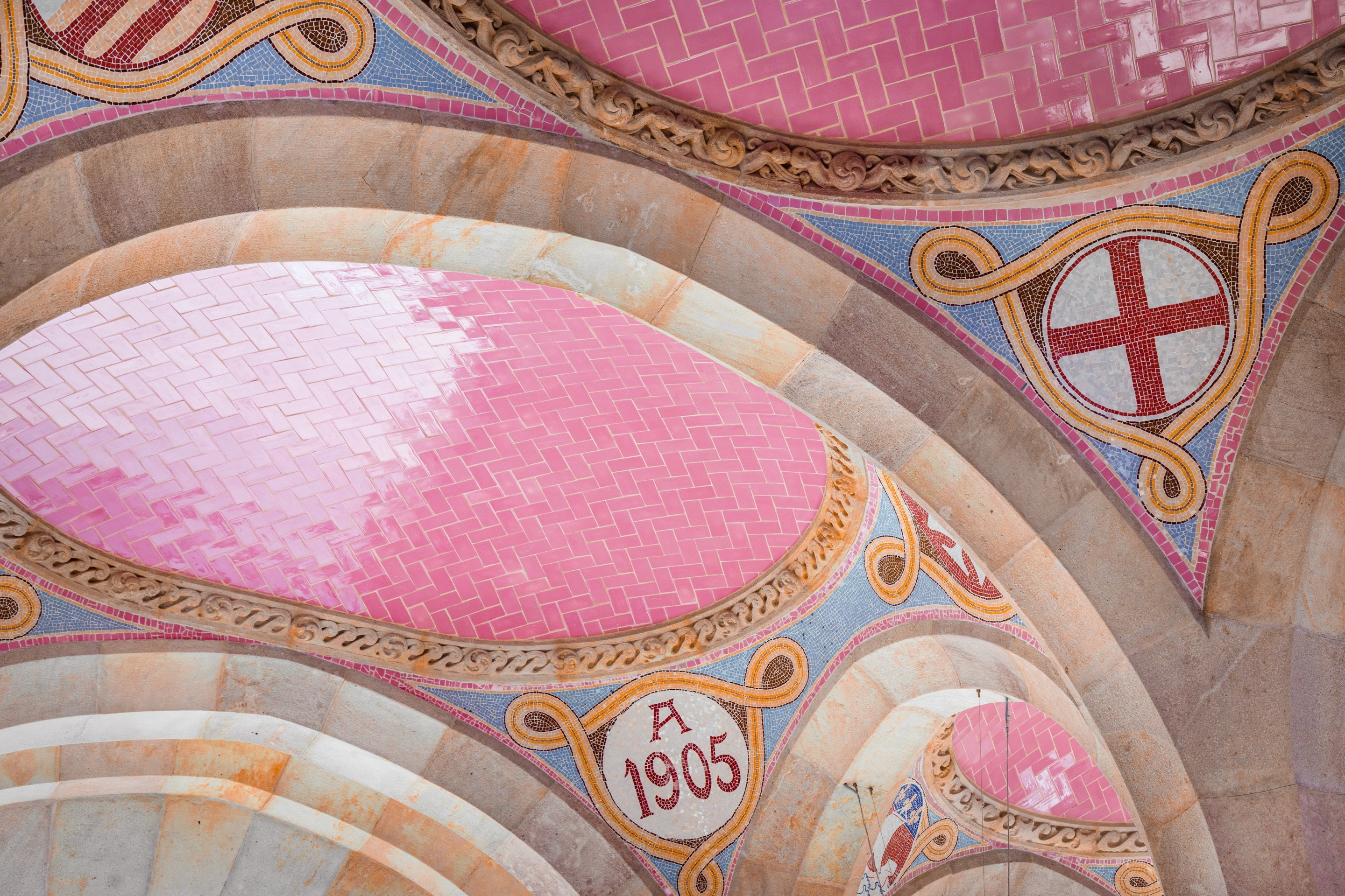 Intricate pink tiled dome roofs at The Hospital de la Santa Creu i Sant Pau, Barcelona.