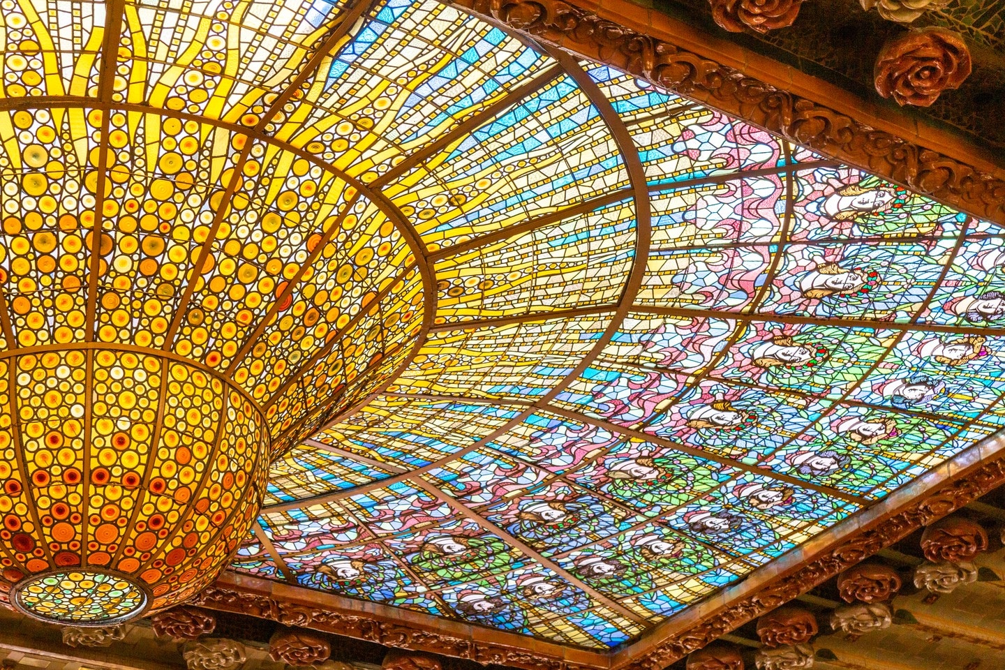 The beautiful stained glass dome at Palau de la Música Catalana, Barcelona.