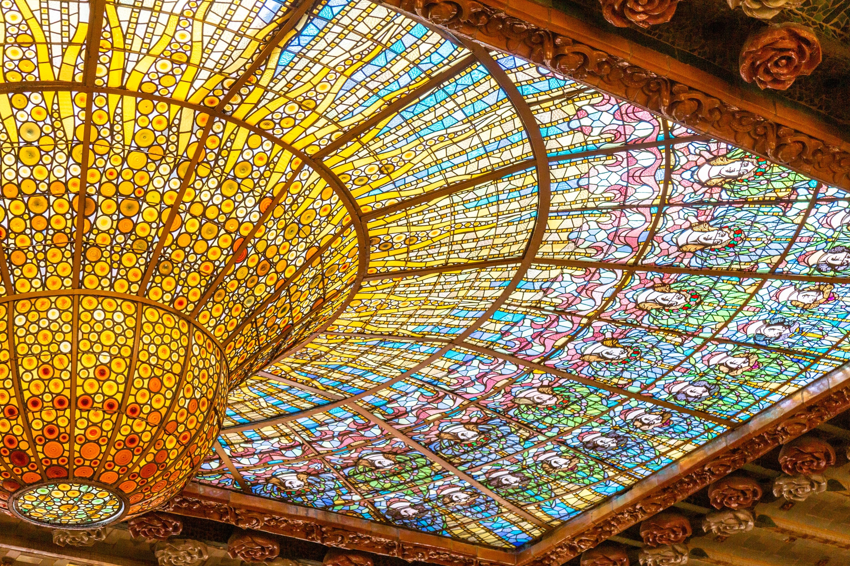 The beautiful stained glass dome at Palau de la Música Catalana, Barcelona.