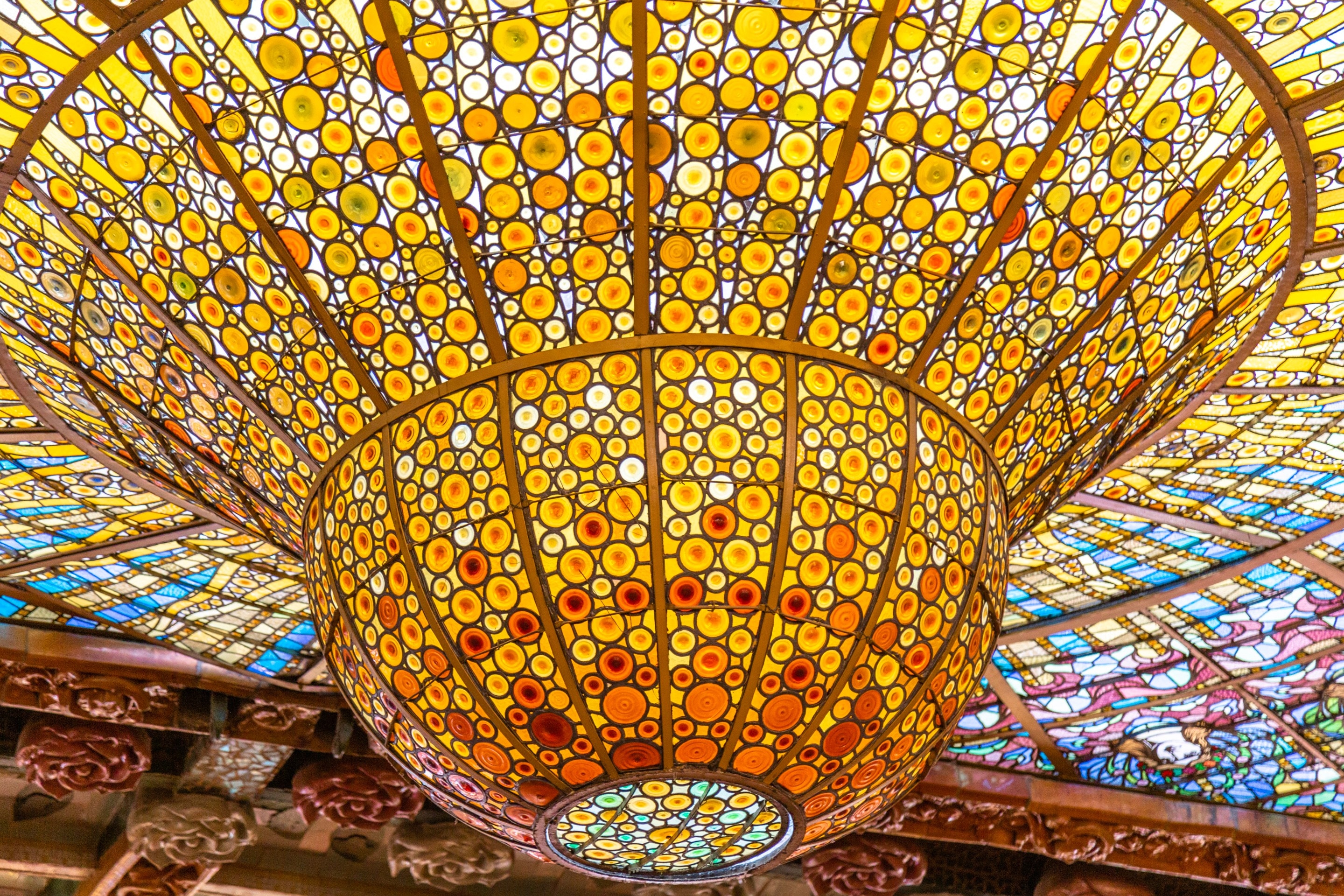 The beautiful stained glass dome at Palau de la Música Catalana, Barcelona.