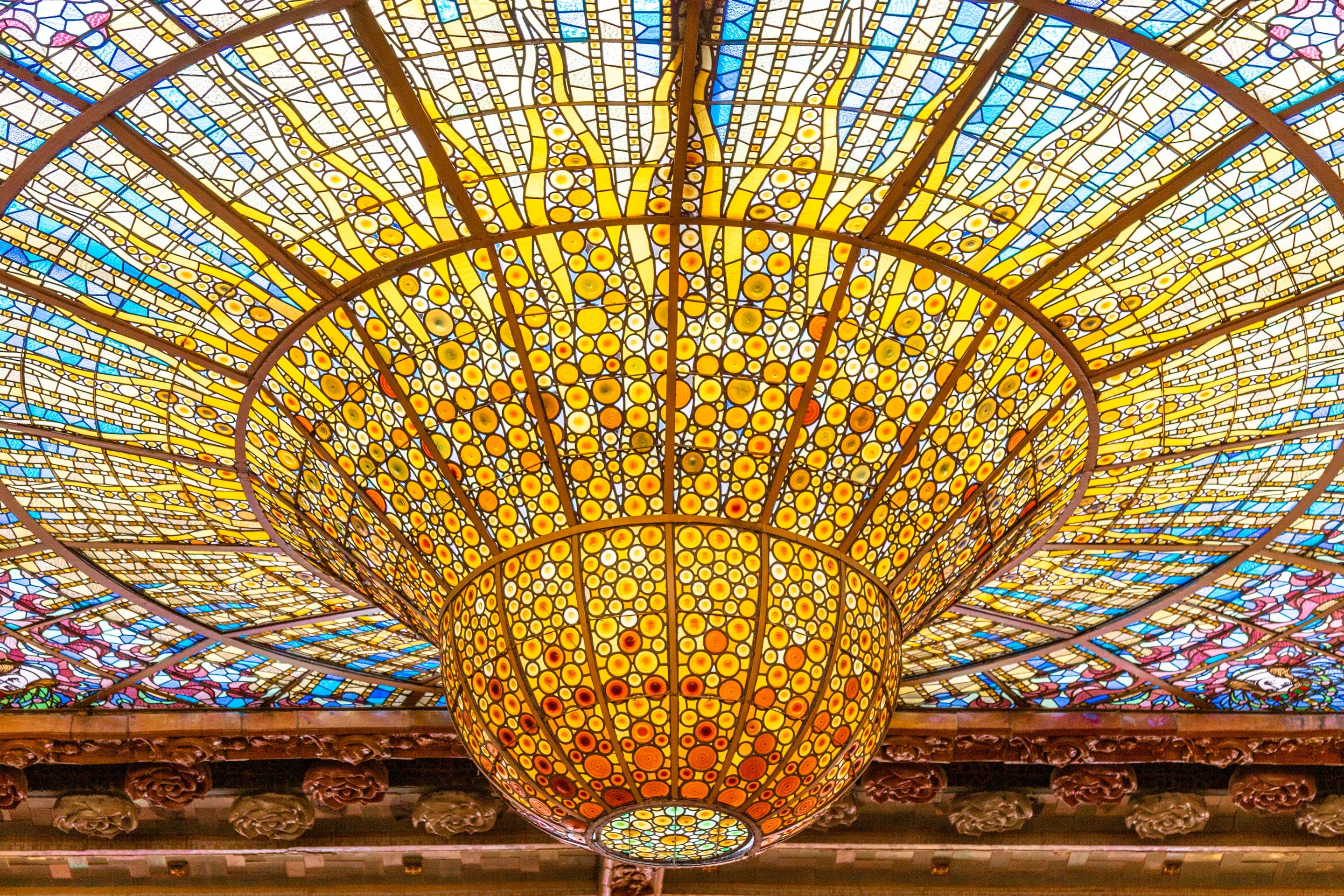The beautiful stained glass dome at Palau de la Música Catalana, Barcelona.