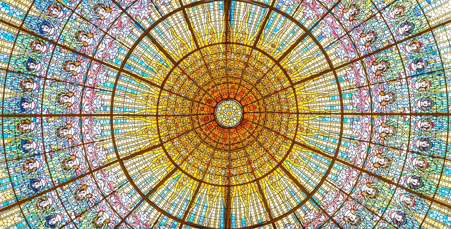 The beautiful stained glass dome at Palau de la Música Catalana, Barcelona.