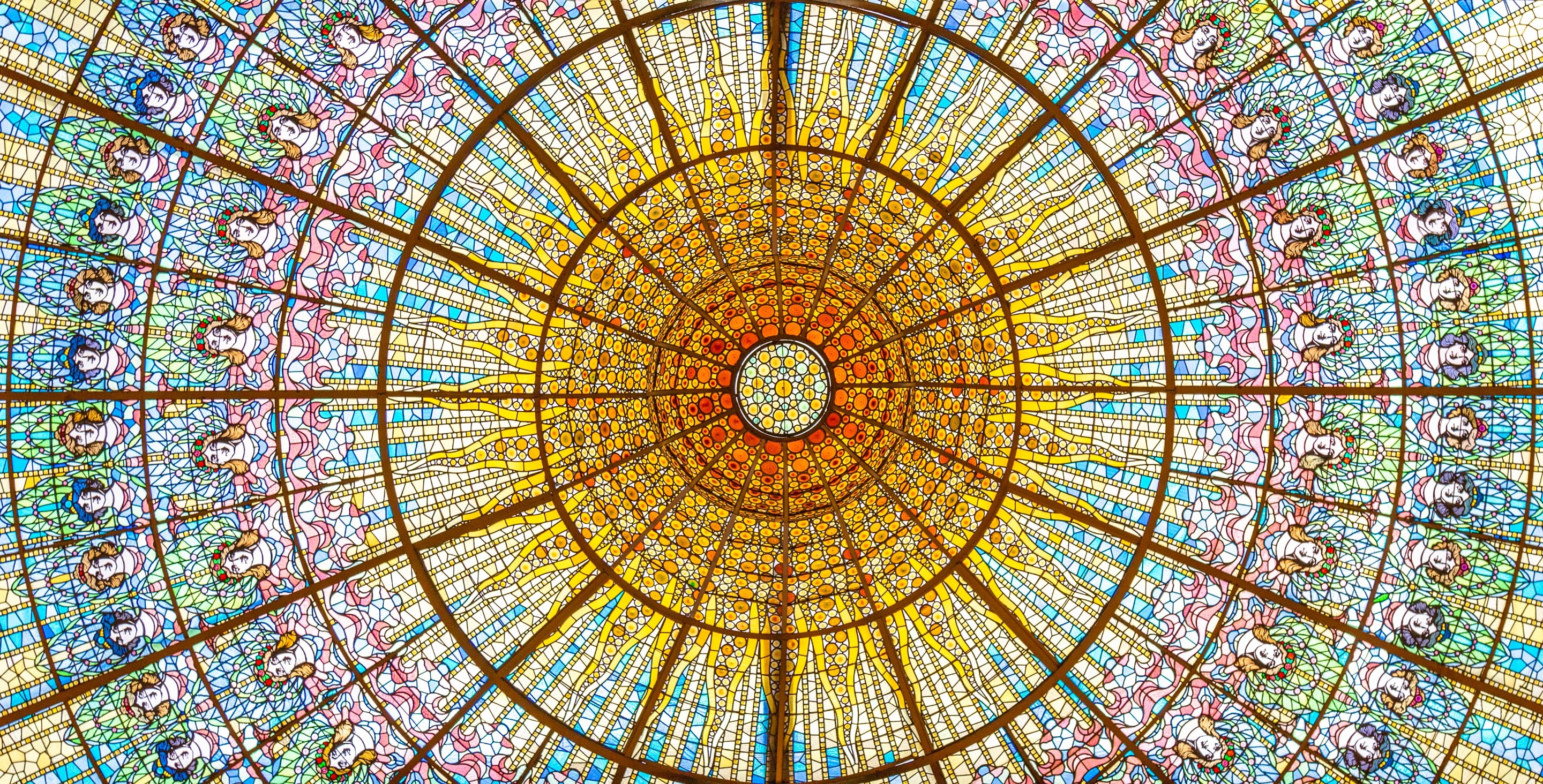 The beautiful stained glass dome at Palau de la Música Catalana, Barcelona.