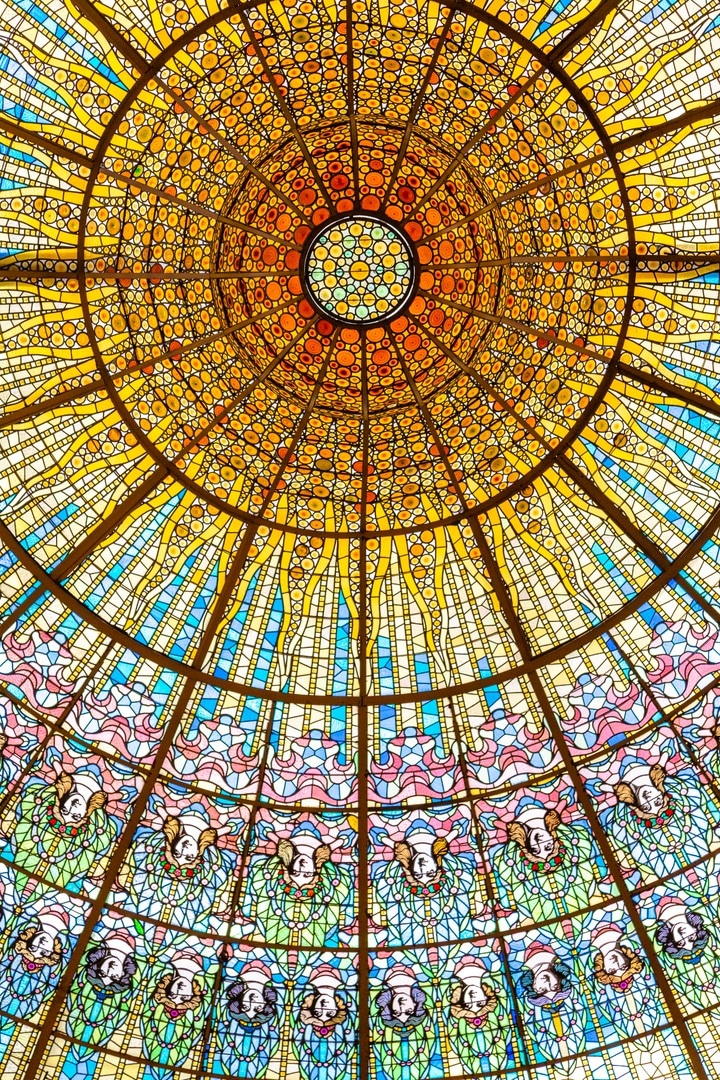 The beautiful stained glass dome at Palau de la Música Catalana, Barcelona.