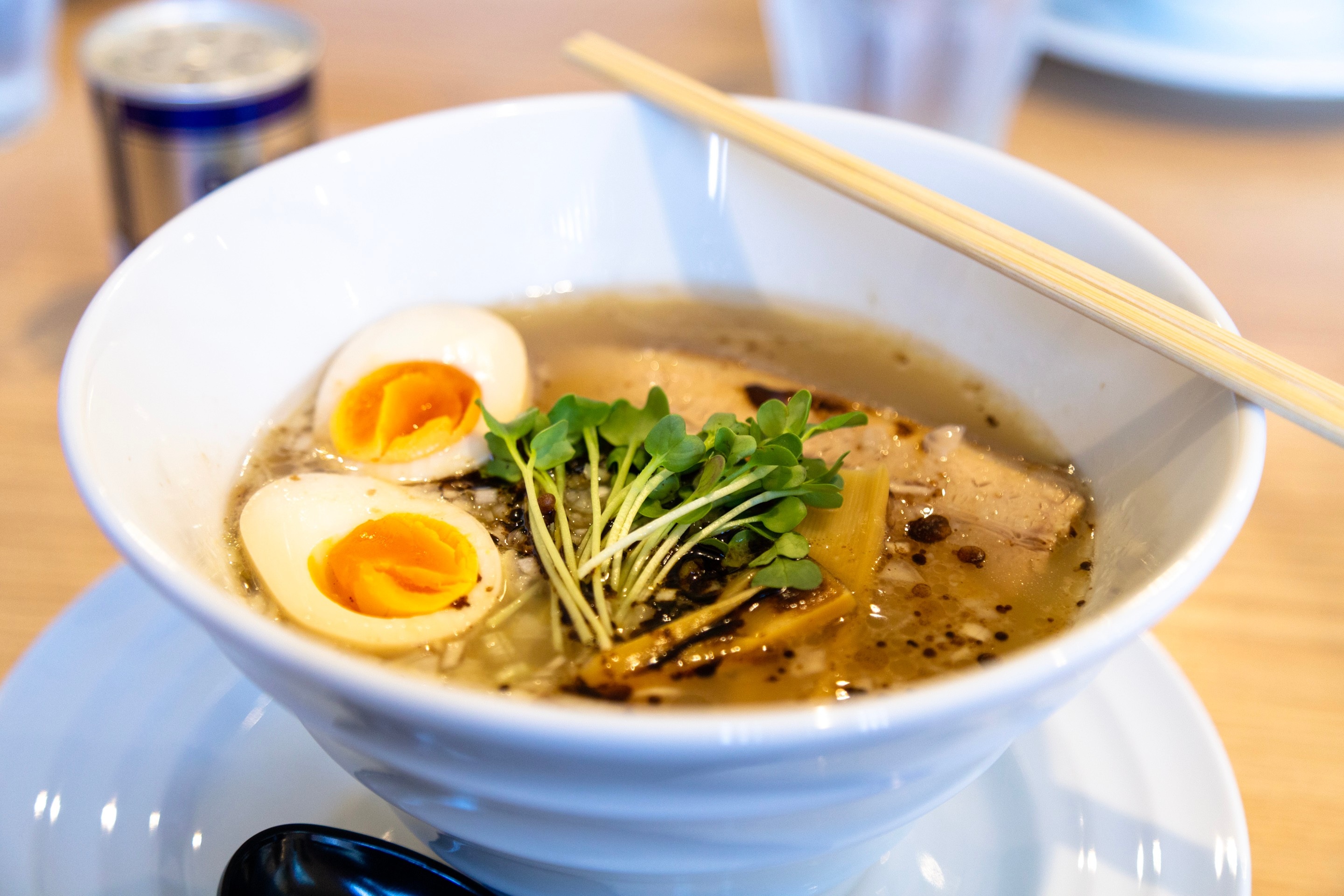 A bowl of fresh ramen, topped with a sliced egg, a bunch of cress and some bamboo shoots — Yanai, Yamaguchi Prefecture, Japan
