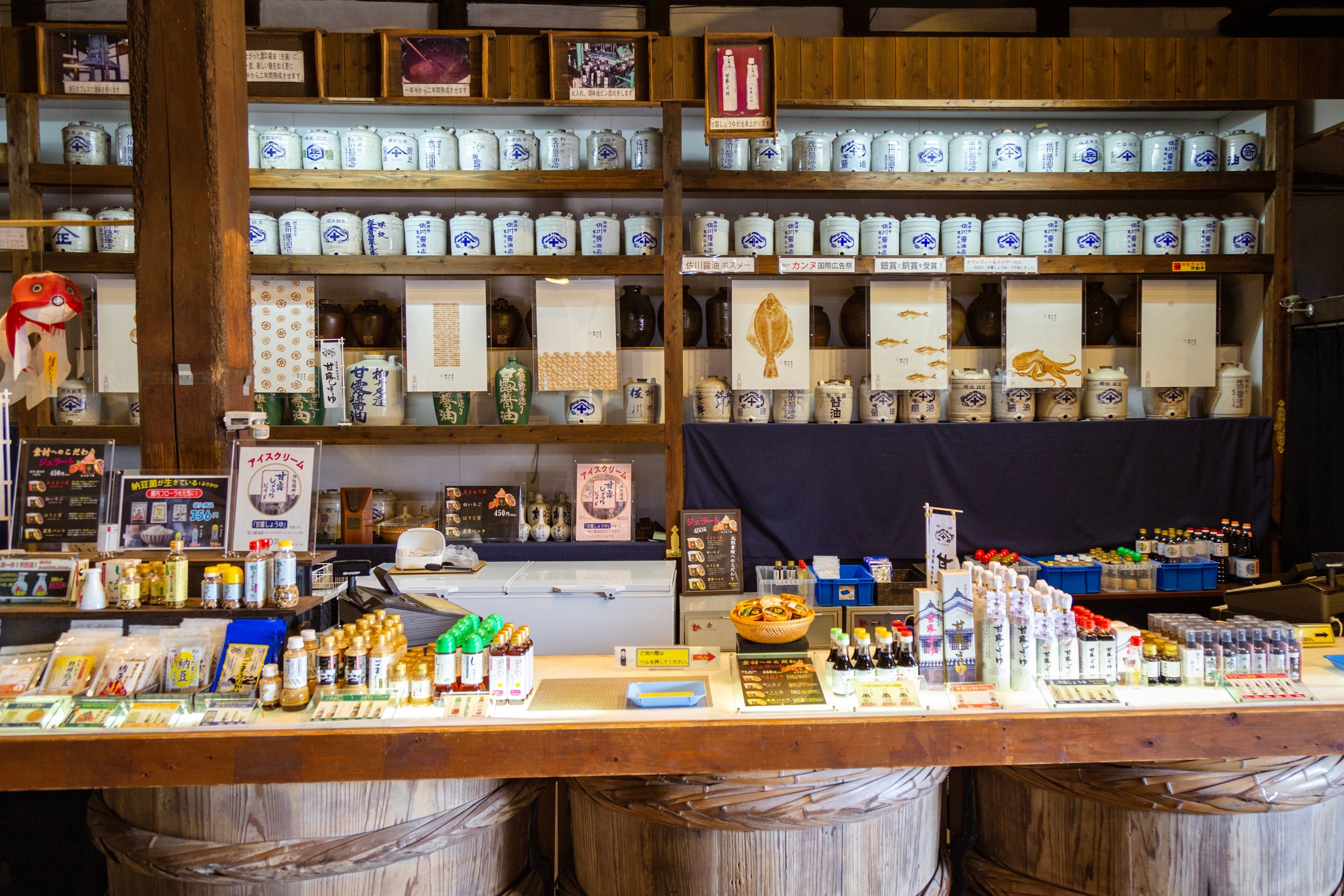 Display counter with many soy sauce related products at the Kanro Joyu Soy Sauce Museum — Yanai, Yamaguchi Prefecture, Japan