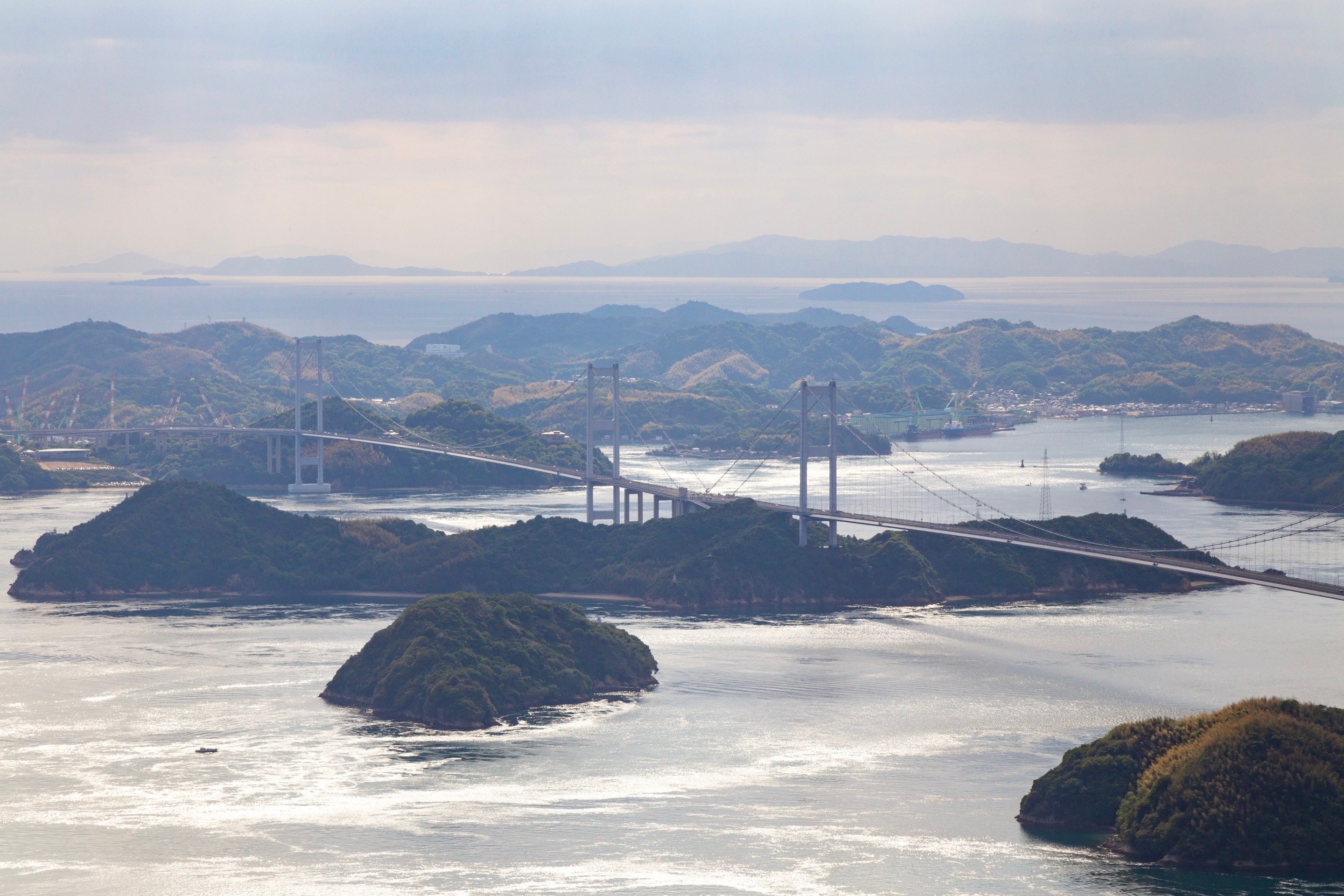 A closer perspective on the Kurushima Kaikyo Bridge and surrounding mountainous islands  — Geiyo Region, Hiroshima Prefecture.