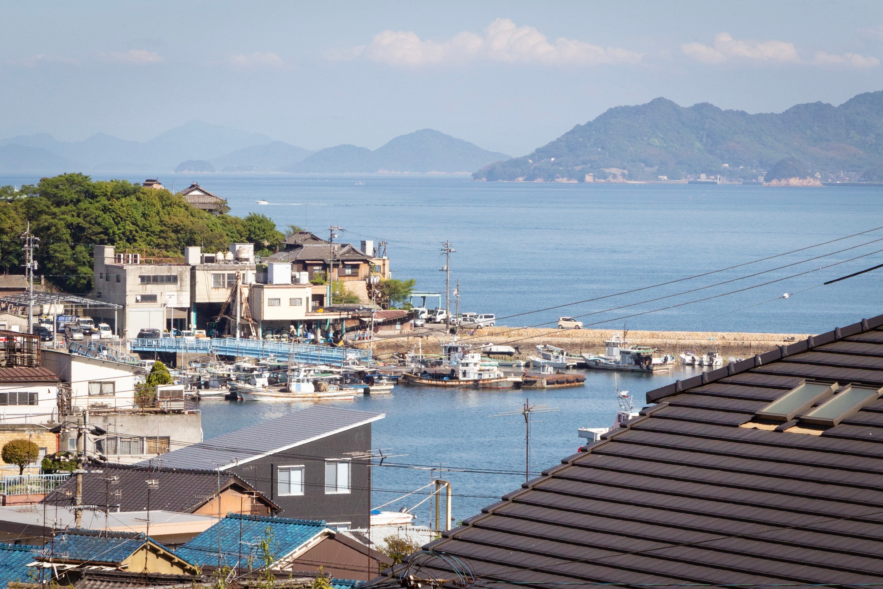 Looking down over house rooftops to Tomonoura Village harbour, Hiroshima Prefecture.