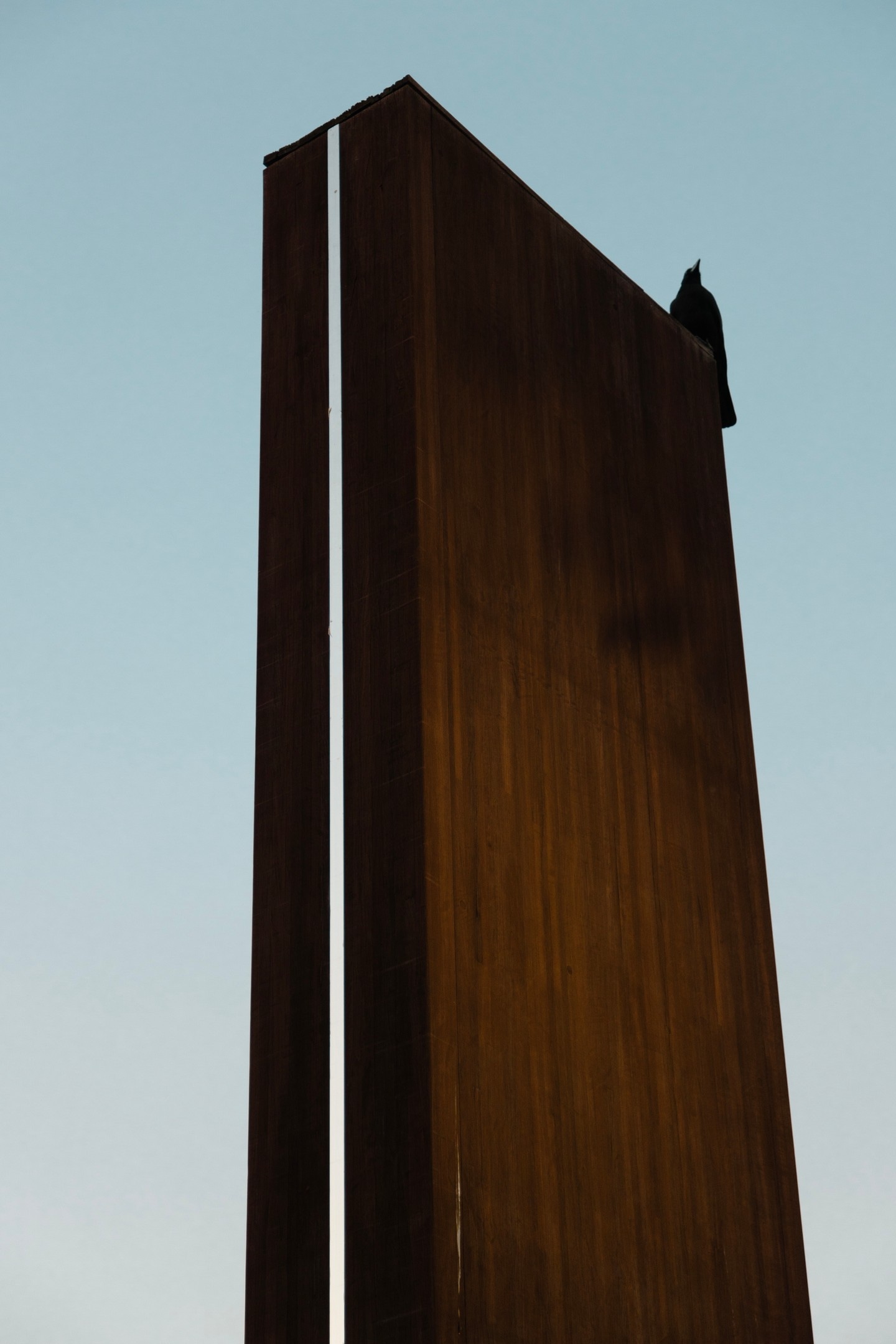 Single karasu on iron sculpture