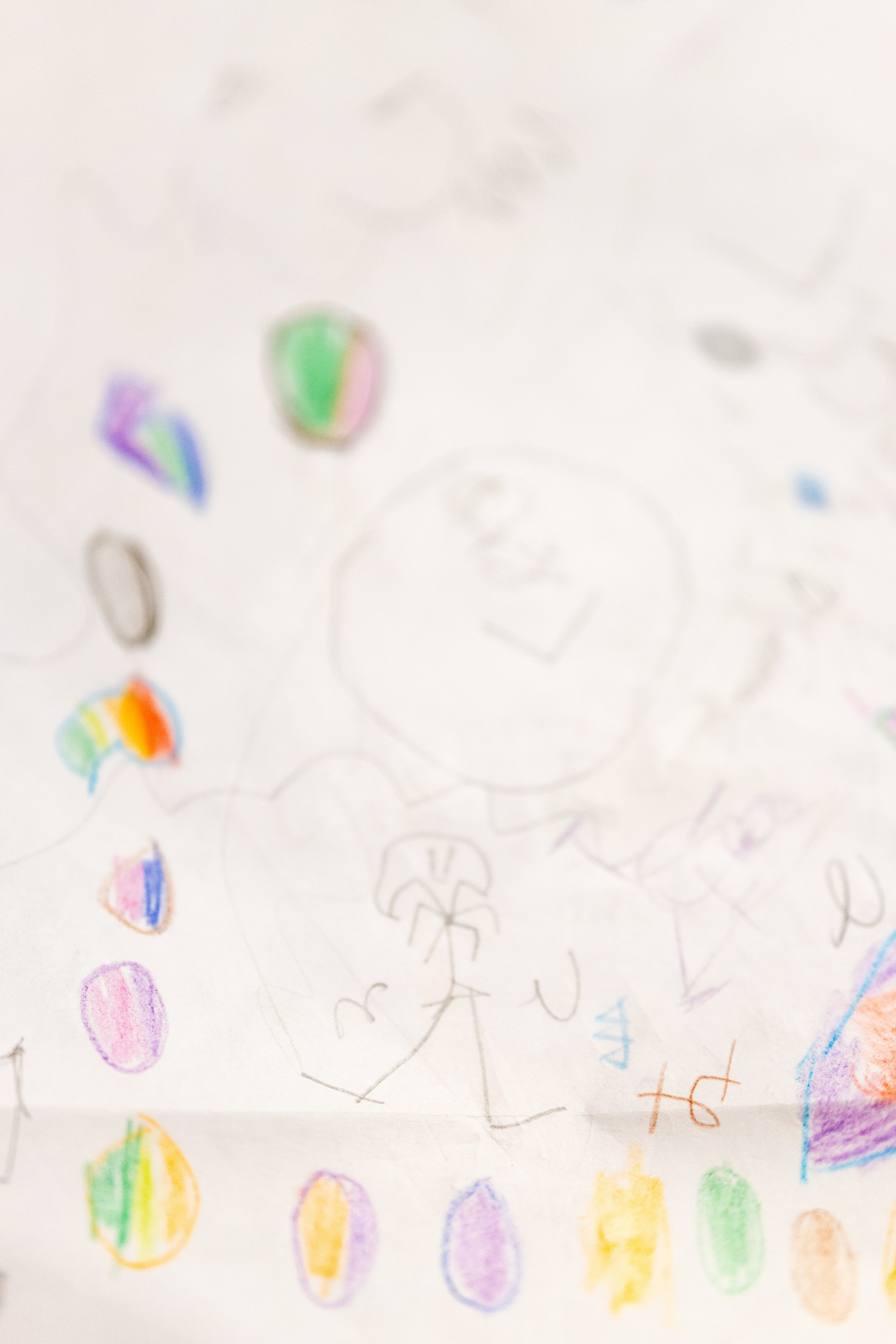 Doodles on paper by a child in her "Doodle Diary" — a place to draw sketches to accompany the new things she's learned. Helping to boost long term memory.