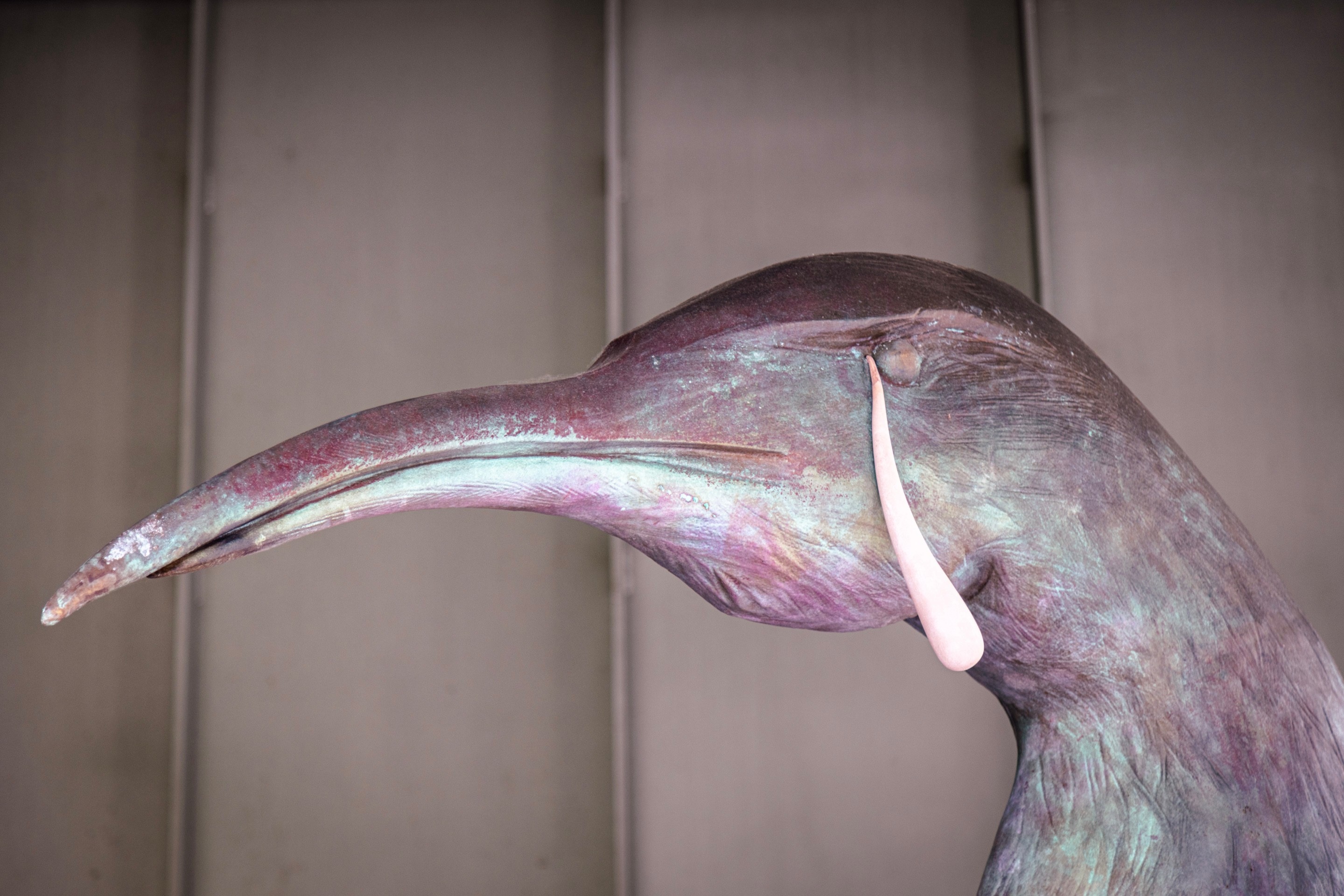 Close-up from a female bird figure surrounded by rubbish: “3,2,1” by Camille Henrot — Middelheim Museum, Antwerp, Belgium