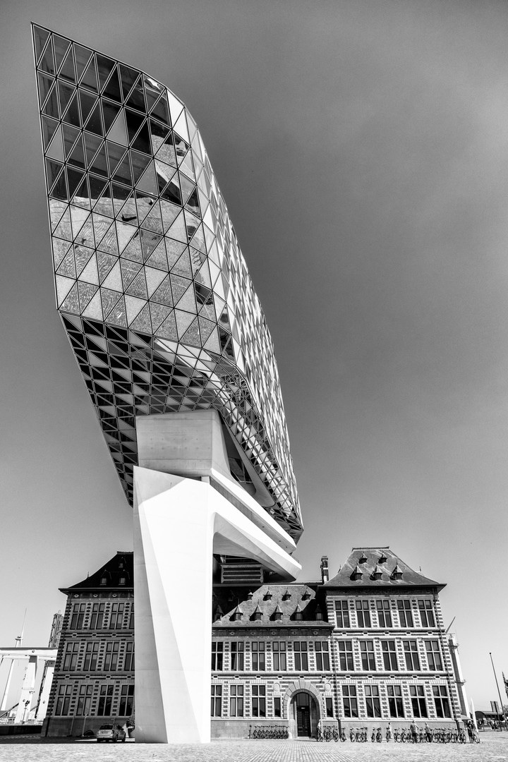 Dramatic high contrast monochrome photo of the south elevation of the Port House by Zaha Hadid — Antwerp, Belgium