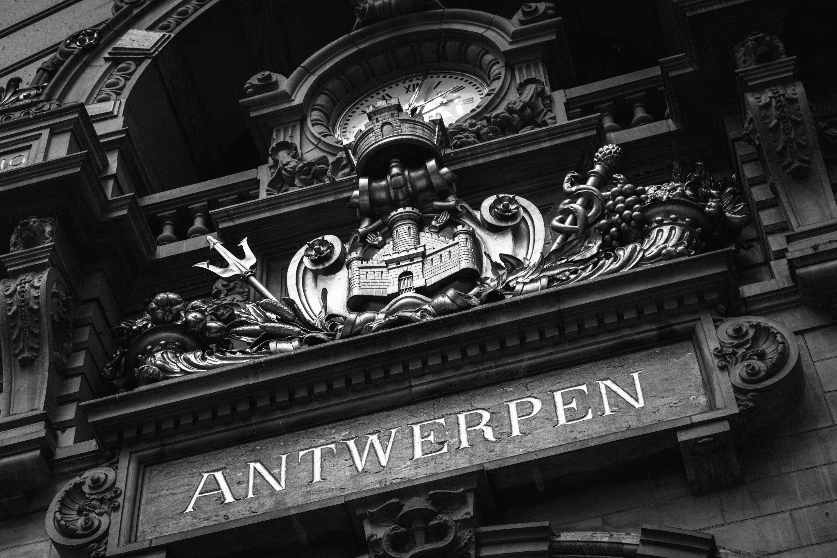 A dramatic black and white photo of the Antwerpen coat of arms — Antwerp Central Station, Antwerp, Belgium