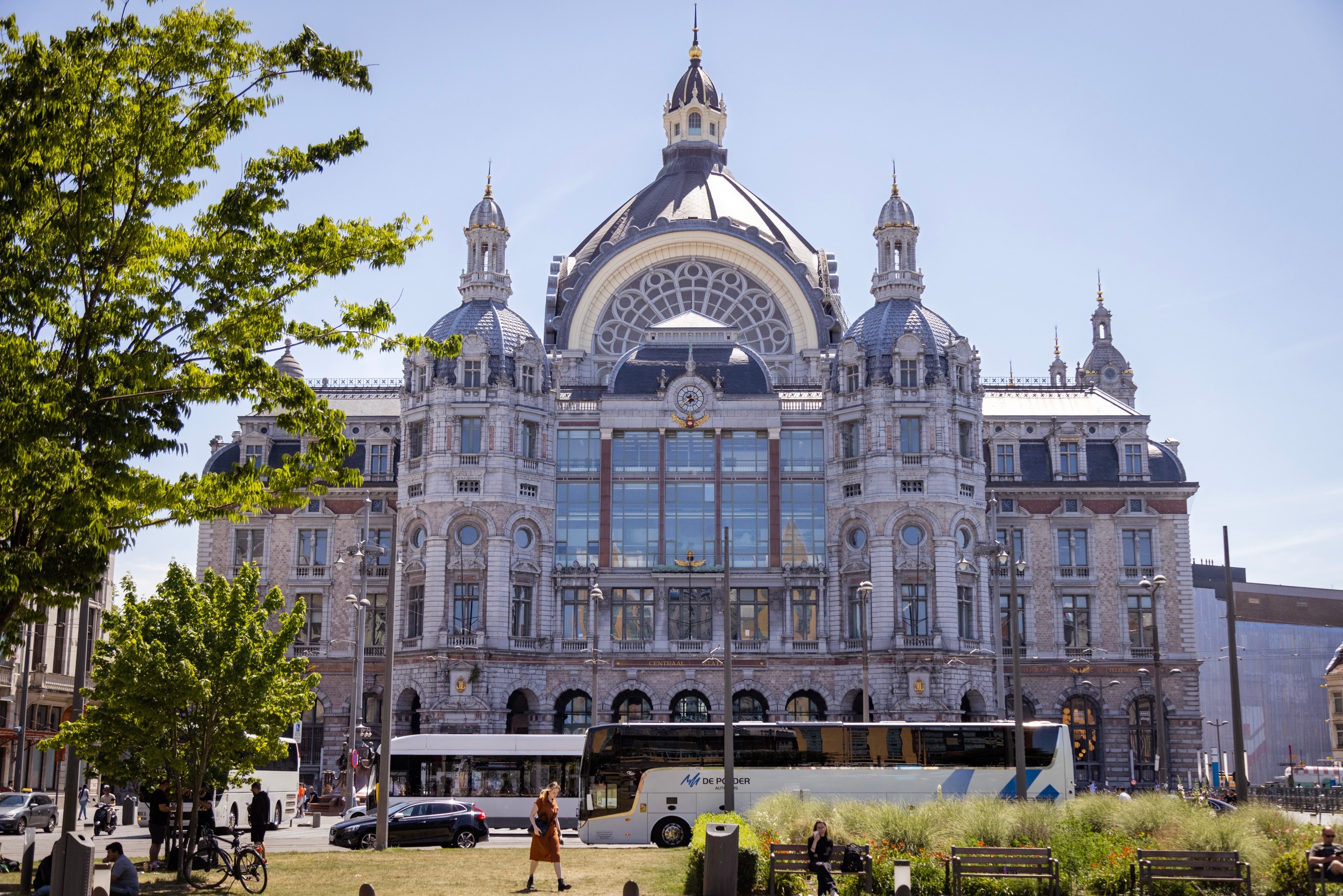 A photo of Antwerp Central Station taken from outside, showing the whole building with city life going on around it — Antwerp, Belgium