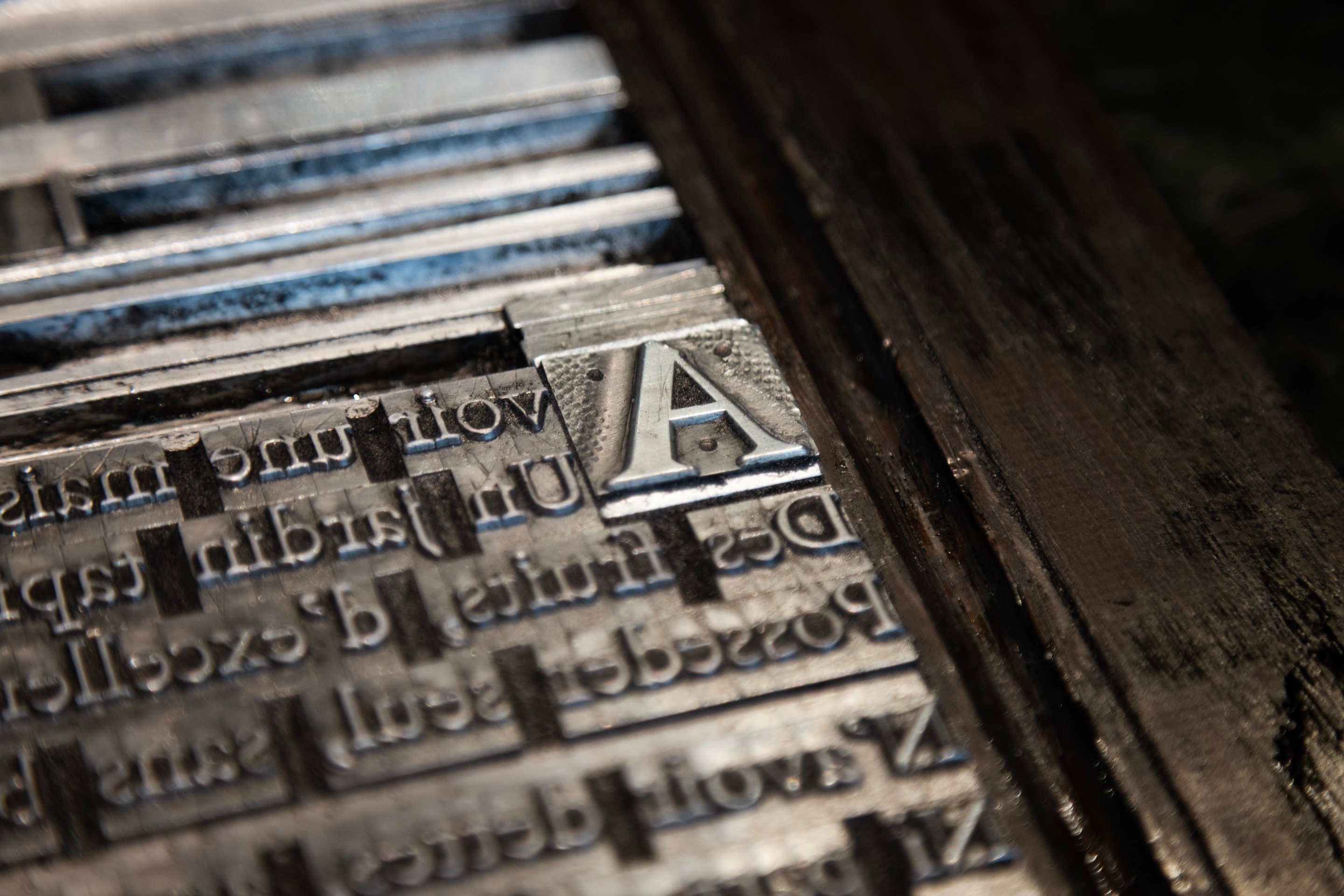 A plate of set moveable type with a drop-cap letter 'A'  — Museum Plantin-Moretus, Antwerp, Belgium 