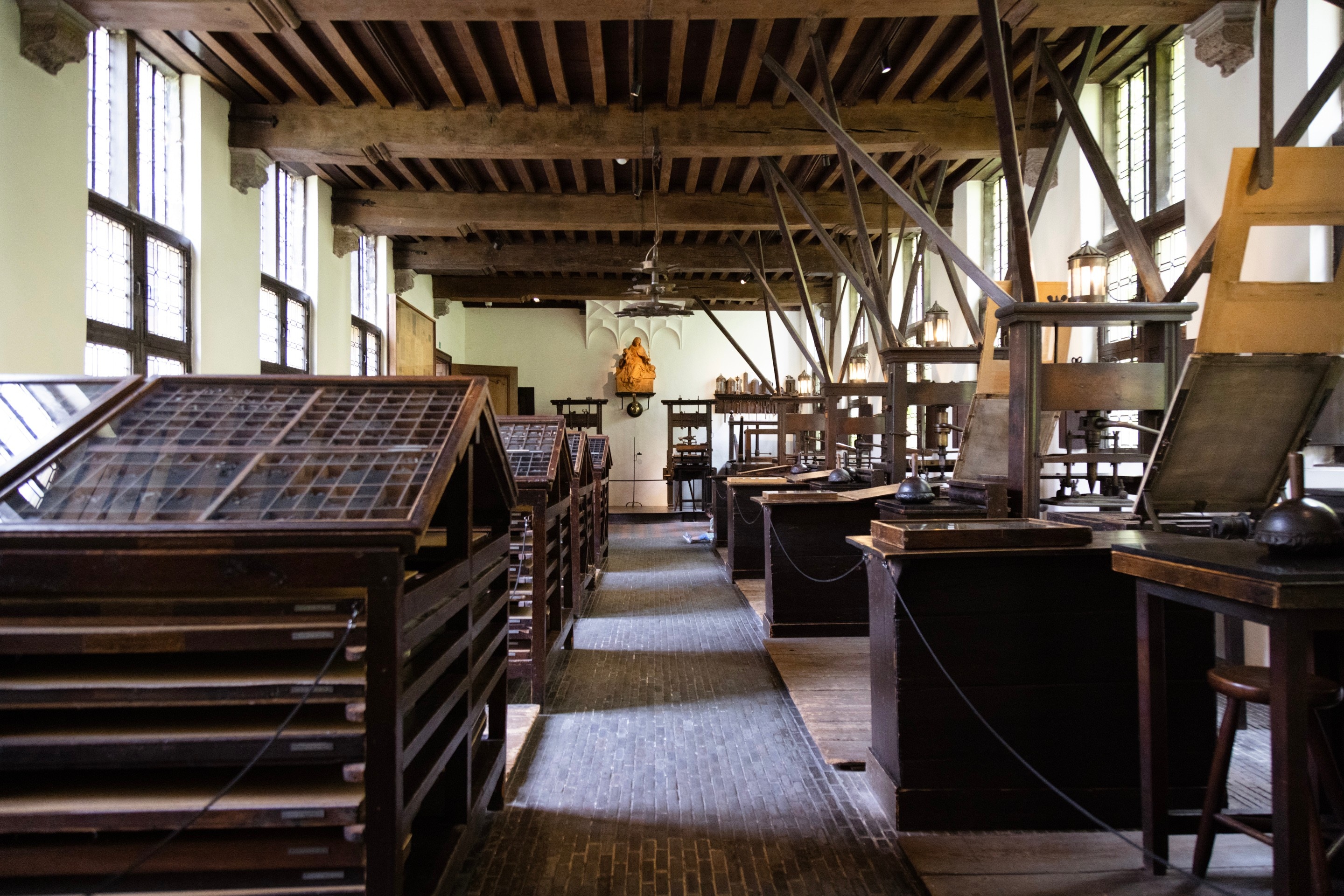 A room full of old printing presses and cases of moveable type — Museum Plantin-Moretus, Antwerp, Belgium 