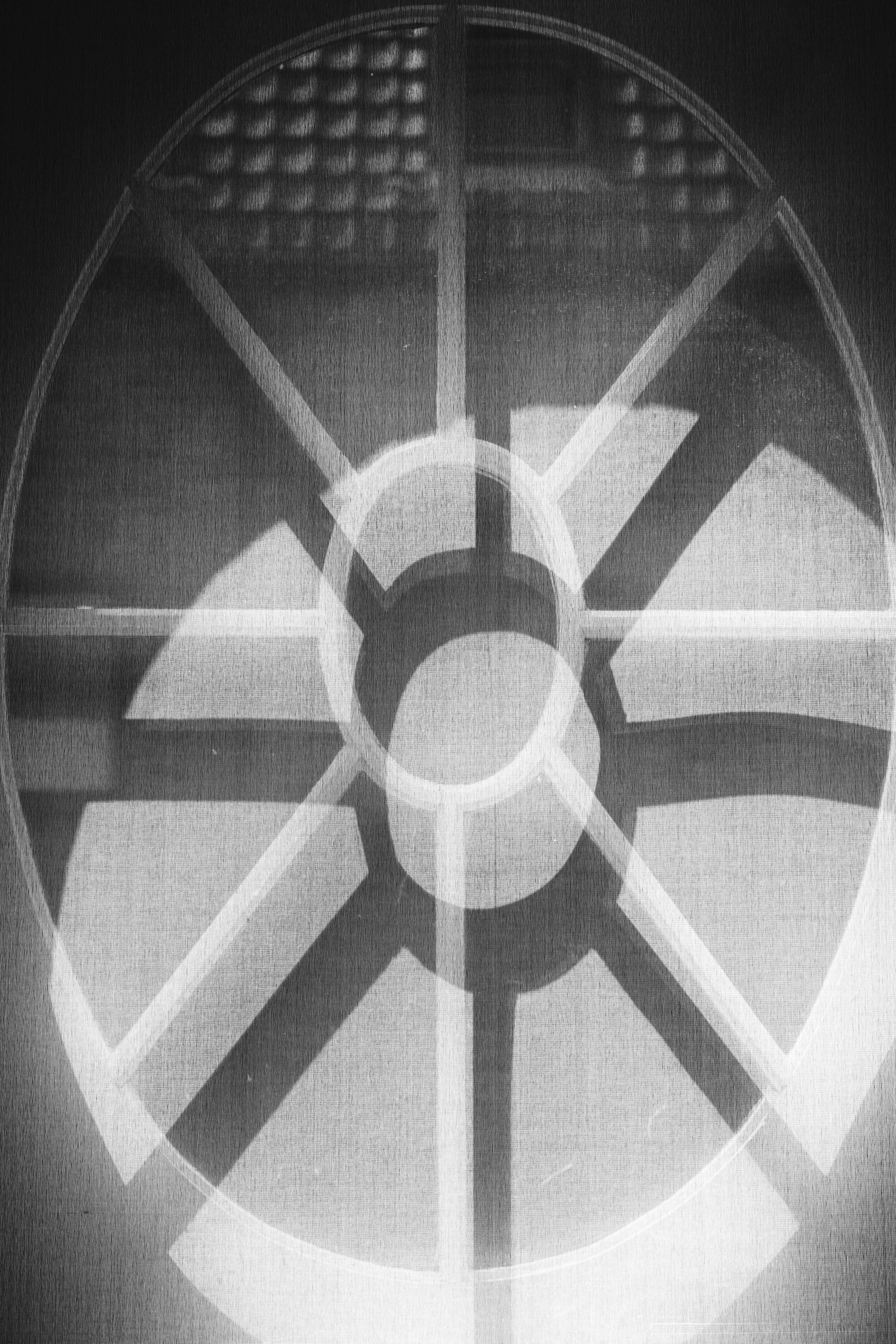 Shadows from a window cast onto a white fabric blind create an abstract image — Museum Plantin-Moretus, Antwerp, Belgium 