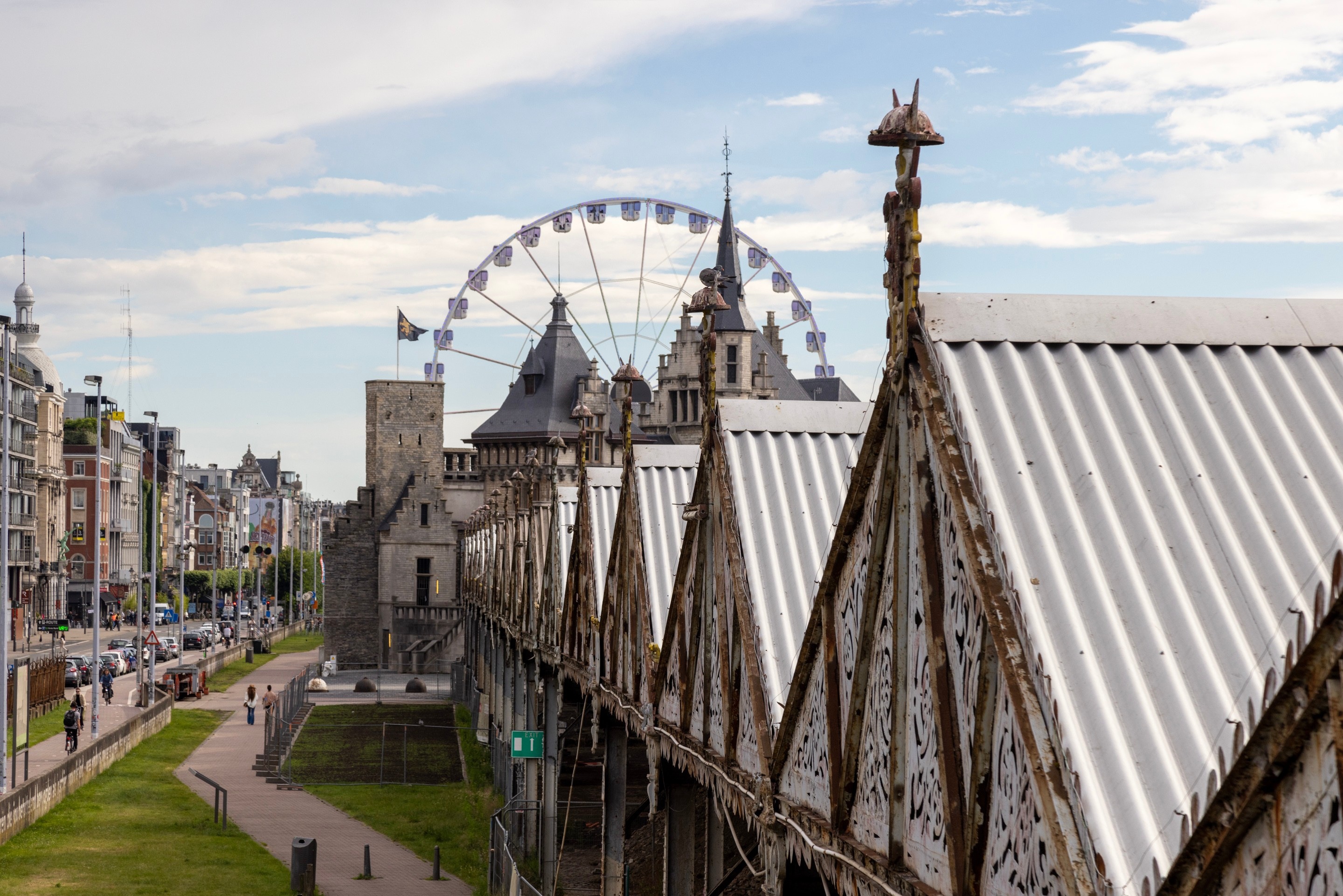 In the forground a perspective view of many of the iron warehouses located in the Het Steen area of Antwerp, the fort and the tourist ferris wheel can be seen in the distance — Antwerp City, Belgium
