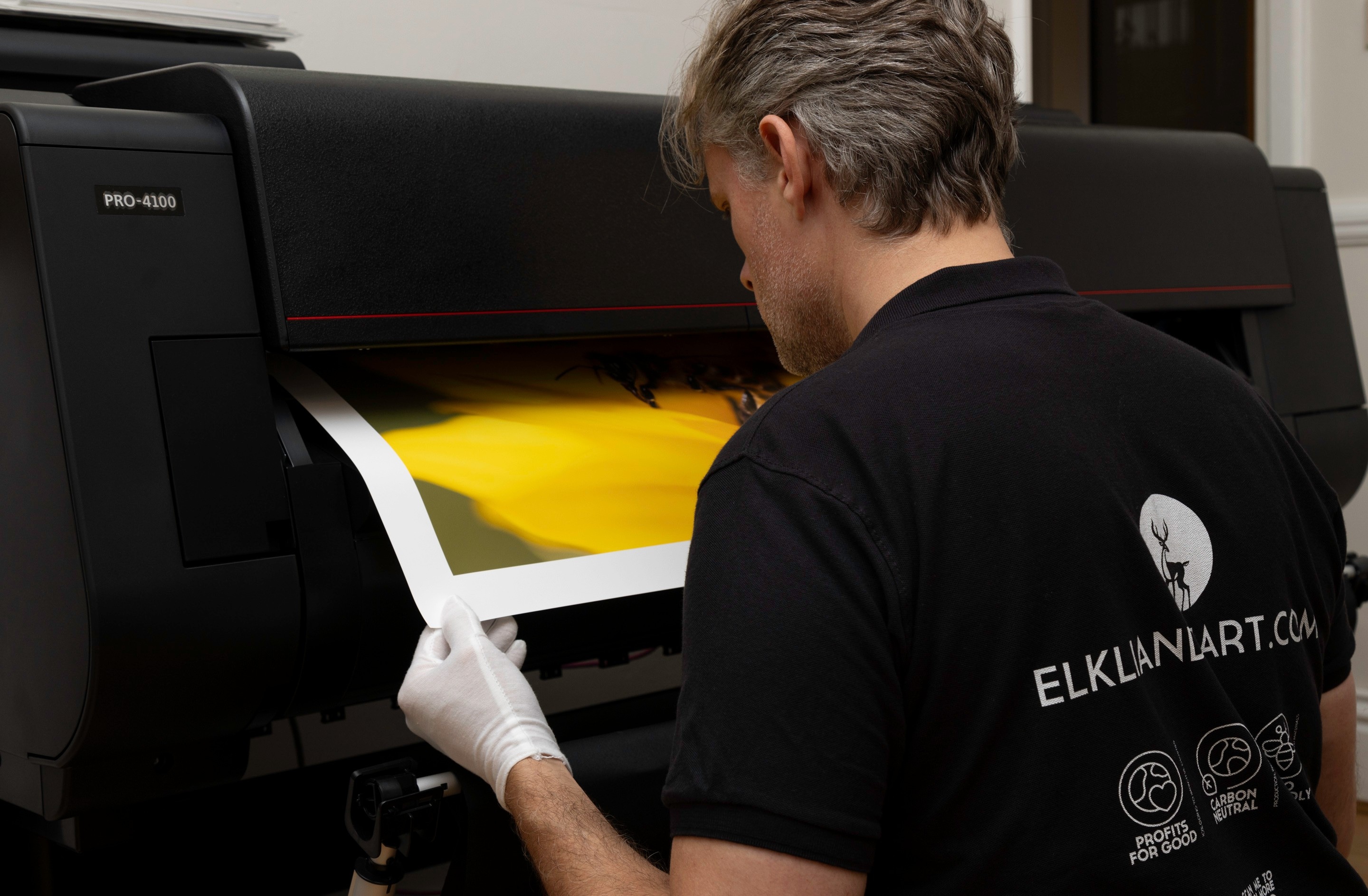 Jake checking the quality of one of our prints as it emerges from the Canon imagePROGRAF PRO-4100 printer.