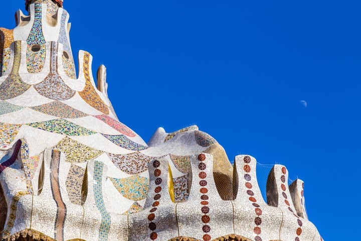 Intricate mosaic tiled tower at Parc Guell, Barcelona.
